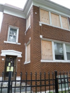 Community groups in Chicago objected to banks evicting paying tenants who were not responsible for the owner unable to make loan payments. Many buildings were boarded up. Photo courtesy of Albany Park Neighborhood Council