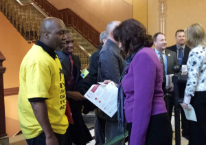 Leader Ali Simmons and Policy Fellow Jonathan Holmes talk with State Rep. Sue Scherer (D-Decatur)