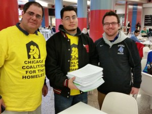 Members of the CCH Statewide Network delivered 1,284 letters to Gov. Rauner. From left, Moe Zayed from Aurora's Hesed House, and Aurora University students Daniel Flores and Michael Luetkemeyer (Photo by Jim Picchetti)