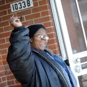 Juanita Patton celebrates as she's about to see her new apartment in Ford Heights (Photos by Stephanie Dowell for Respond Now)
