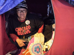 Linda, who crochets hats and other items from her tent beneath the Wilson Avenue viaduct on Lake Shore Drive, is skeptical about the cityÕs promise to find her housing. ÒI aint gonna hold my breath,Ó she said. | Mark Brown/Sun-Times