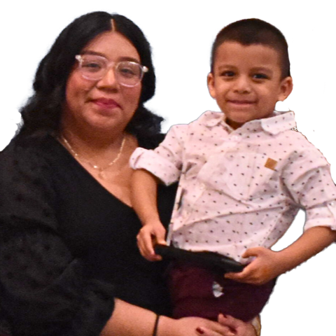 Julie Campos, a Latina woman in her 20s, holds her young son.