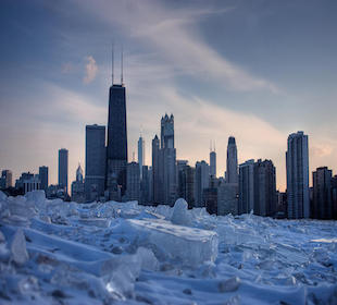 The skyline of Chicago sits behind an icy Lake Michigan.